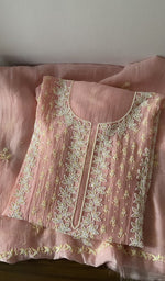 Folded kurta piece and dupatta, chikankari along the hem
