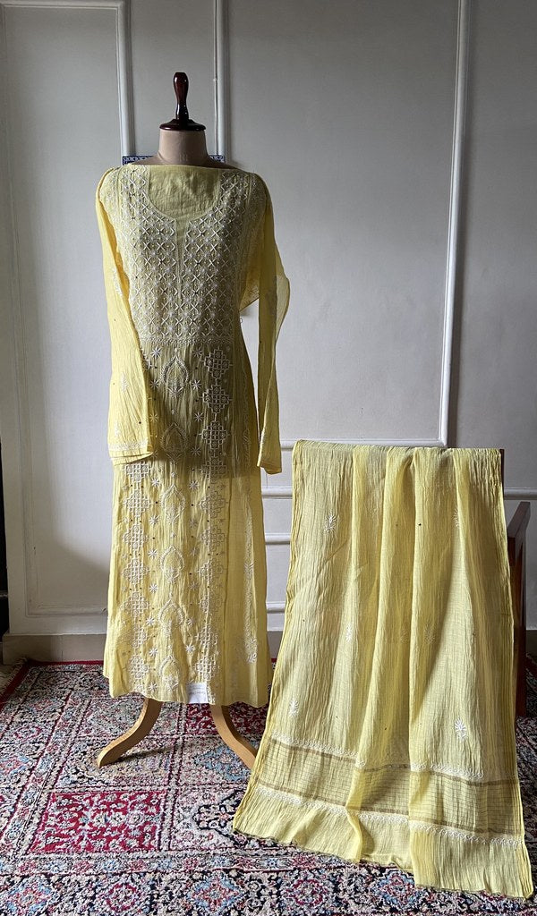 yellow pure mul chanderi chikankari 3 pc semi-stitched anarkali suit set on mannequin