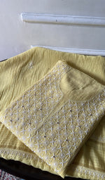 Load image into Gallery viewer, yellow chikankari set folded, worked panel on top