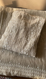 Folded beige mul chanderi kurta, front view