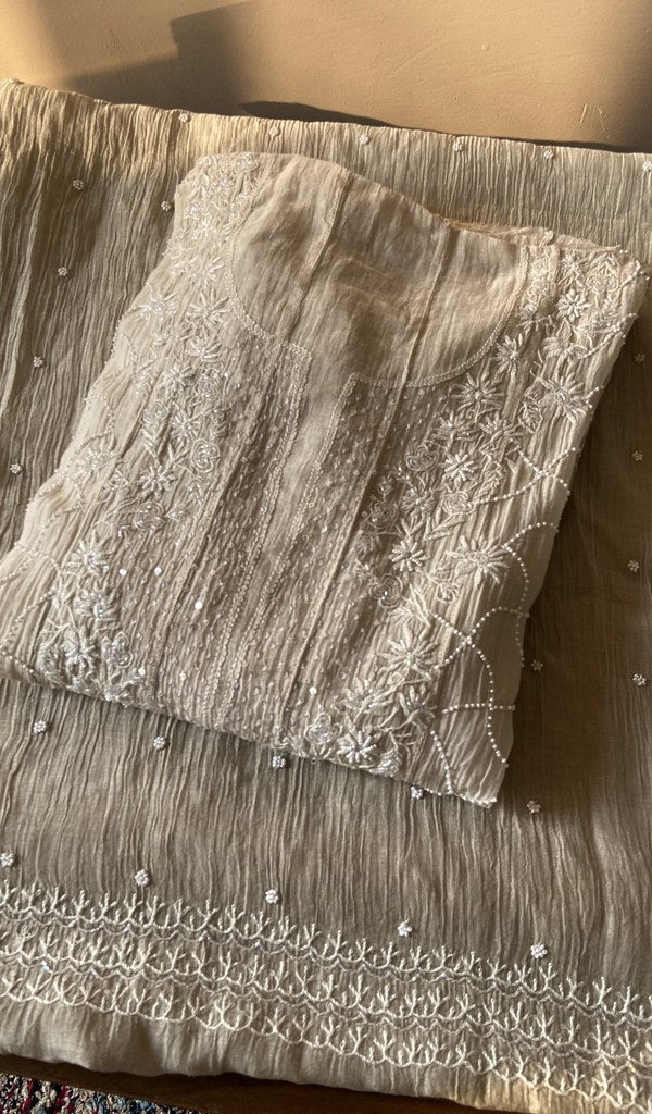 Folded beige mul chanderi kurta, front view