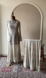Beige mul chanderi set on the mannequin with its dupatta