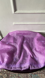 Bottom in glace cotton draped over the stool