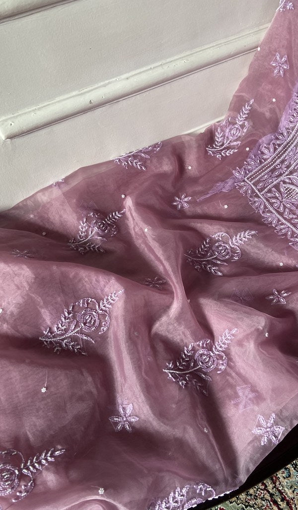 Dusty pink kurta piece laid out, work across the body