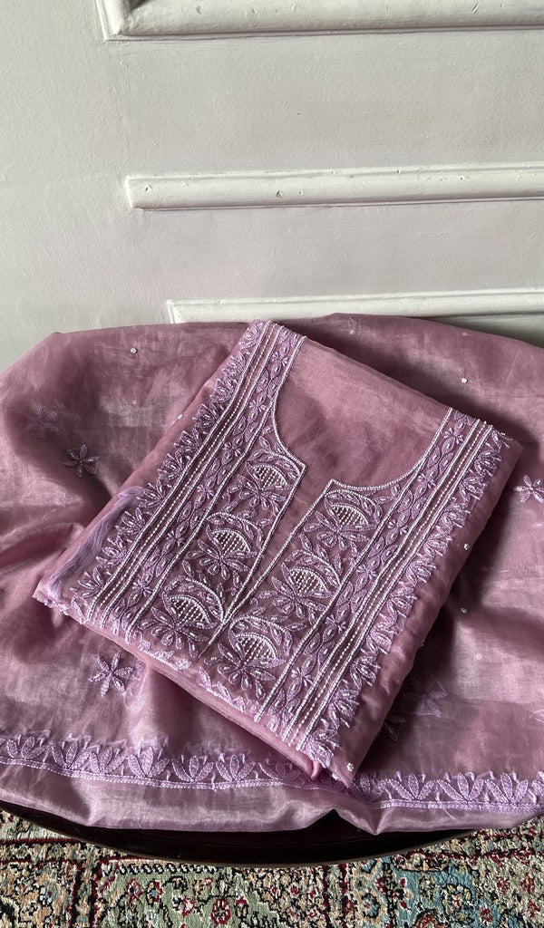 The dusty pink pieces folded and stacked