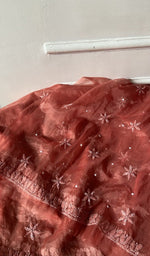 Load image into Gallery viewer, Detail of the embroidery on the rust organza