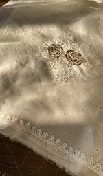 The ivory kurta, spread out flat