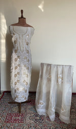 Ivory organza silk set on the mannequin with its dupatta