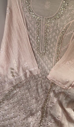 Sleeve work in cream thread on pink pure mul chanderi