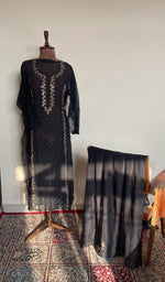 The set on the mannequin with its dupatta beside it