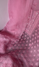 Motifs across the body of the pink kurta