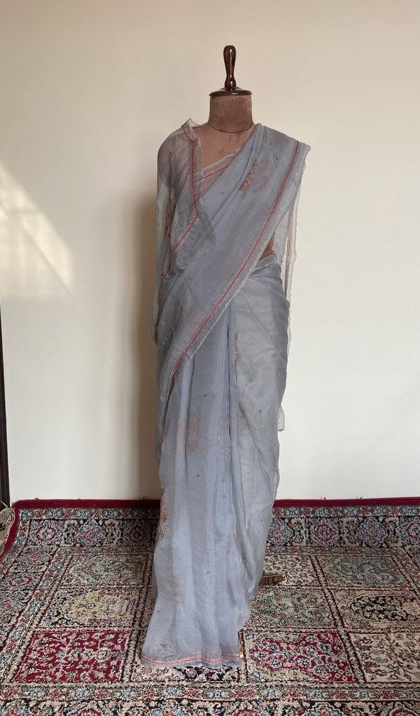 Grey organza silk saree draped on the mannequin, front view