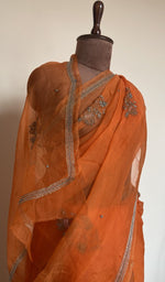 Do taar and teen taar chikankari motifs on pallu and allover on the tangerine orange saree