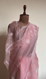 Baby pink saree on the mannequin, close view