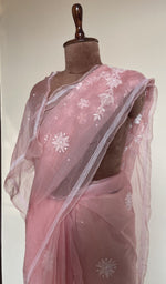 Fine do taar chikankari on border and palla on the baby pink saree