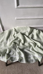 fabric laid out, green pure mul chanderi