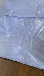 The dupatta spread out, periwinkle blue mul chanderi