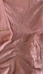 Motifs across the body of the rose peach kurta