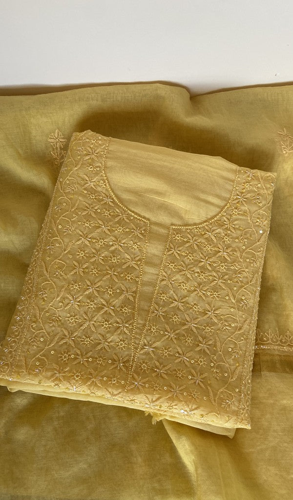 Yellow pure mul chanderi kurta piece folded, fine chikankari on gala and boota with beads and sequins