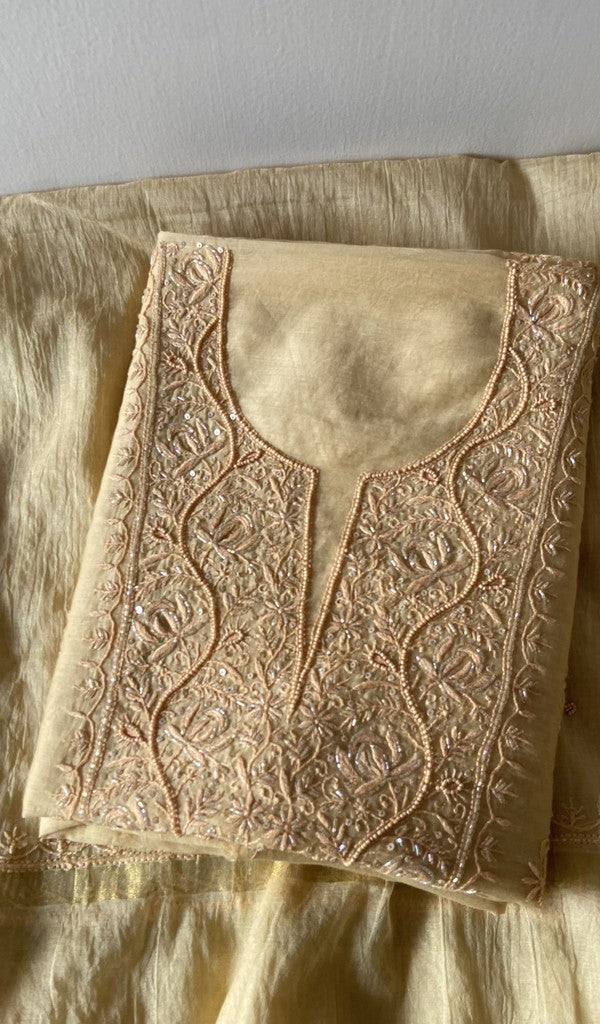 Beige pure mul chanderi kurta piece folded, fine chikankari on gala and boota with beads and sequins