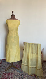 The set on the mannequin with its dupatta beside it
