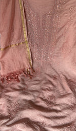 Motifs across the body of the deep peach kurta
