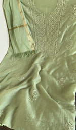 Pista green mul chanderi laid flat on the table