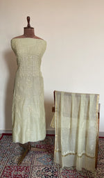 Sage green mul chanderi set on the mannequin with its dupatta