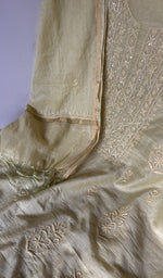 Motifs across the body of the beige kurta