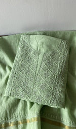 Green pure mul chanderi kurta piece folded, fine chikankari on gala and boota with beads and sequins