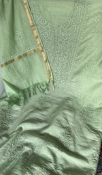 Motifs across the body of the green kurta