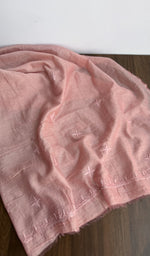 The dupatta spread out, salmon pink mul chanderi