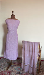 Lilac mul chanderi set on the mannequin with its dupatta