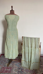 Mint green mul chanderi set on the mannequin with its dupatta
