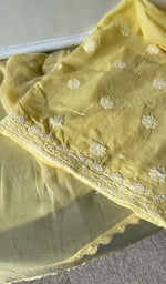 border and hem of the yellow kurta piece