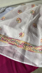 border and hem of the white kurta piece