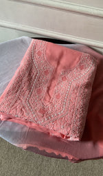 Folded stack, peach on the carpet