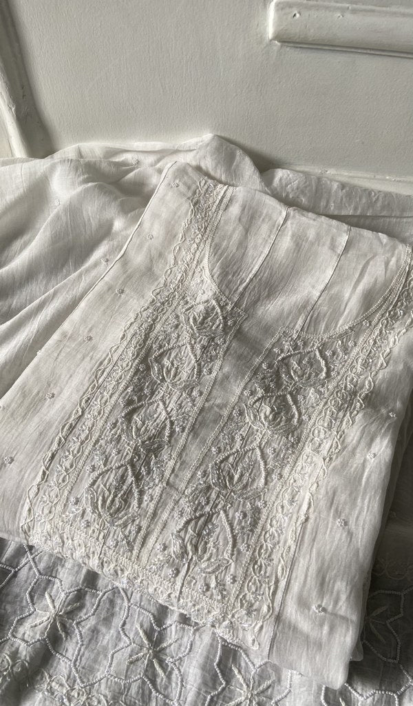 off white pure mul chanderi kurta piece folded, fine chikankari on neck and allover sleeve with beautiful be