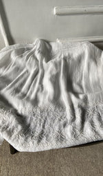 Bottom fabric draped over the stool