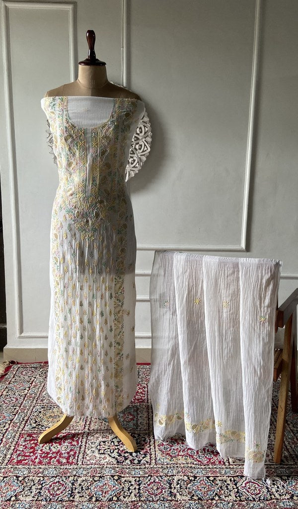 white pure mul chanderi chikankari 2 pc unstitched suit set on mannequin