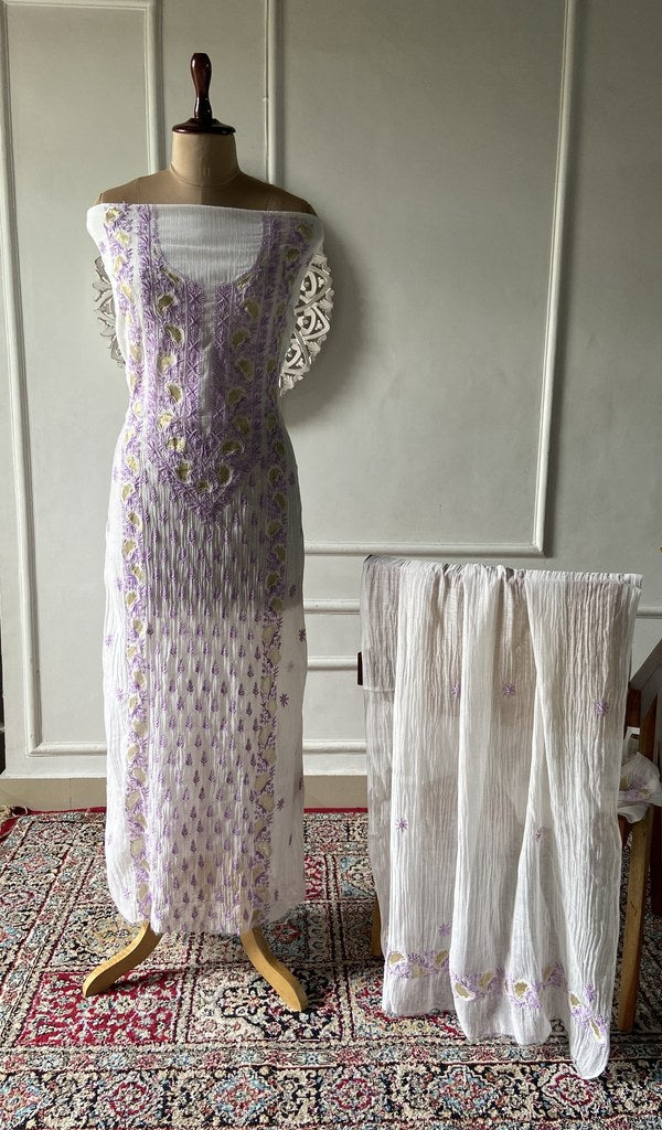 white pure mul chanderi chikankari 2 pc unstitched suit set on mannequin