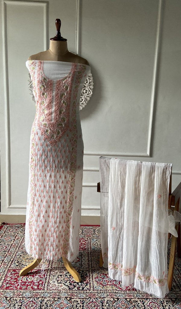 white pure mul chanderi chikankari 2 pc unstitched suit set on mannequin