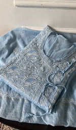 Load image into Gallery viewer, light blue chikankari set folded, worked panel on top