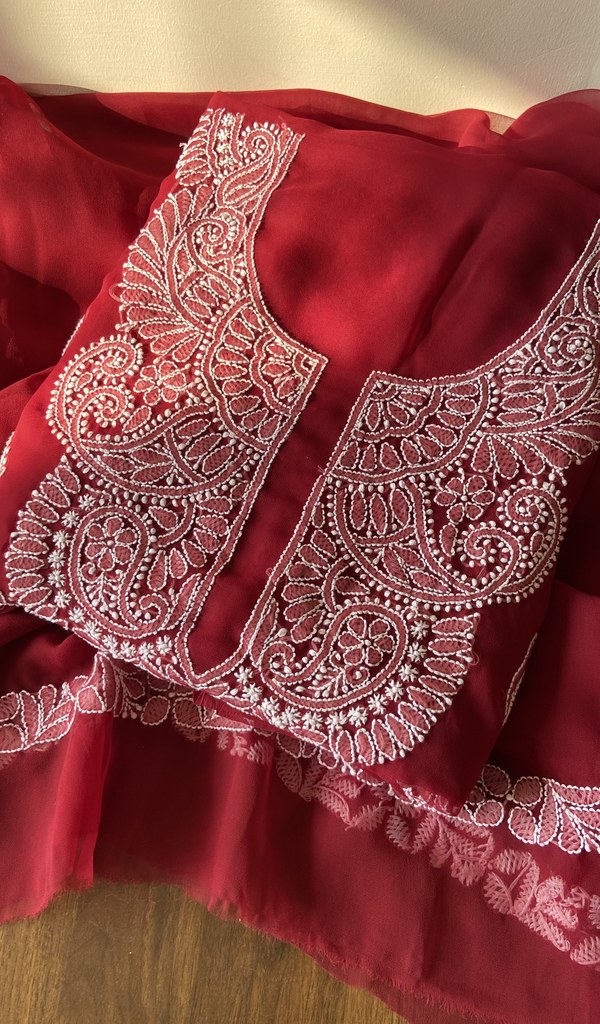 Folded maroon faux georgette kurta, front view