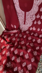 Maroon faux georgette laid out flat