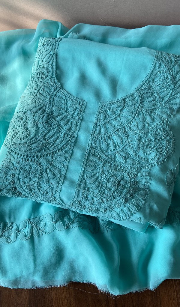 Folded turquoise faux georgette kurta, front view