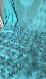 Turquoise faux georgette laid out flat