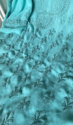 Close view of the turquoise kurta fabric