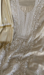 Motifs across the body of the beige kurta