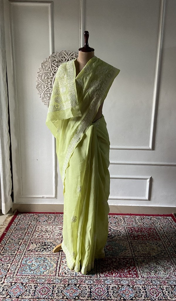 Lime green cotton voile chikankari saree draped on the mannequin